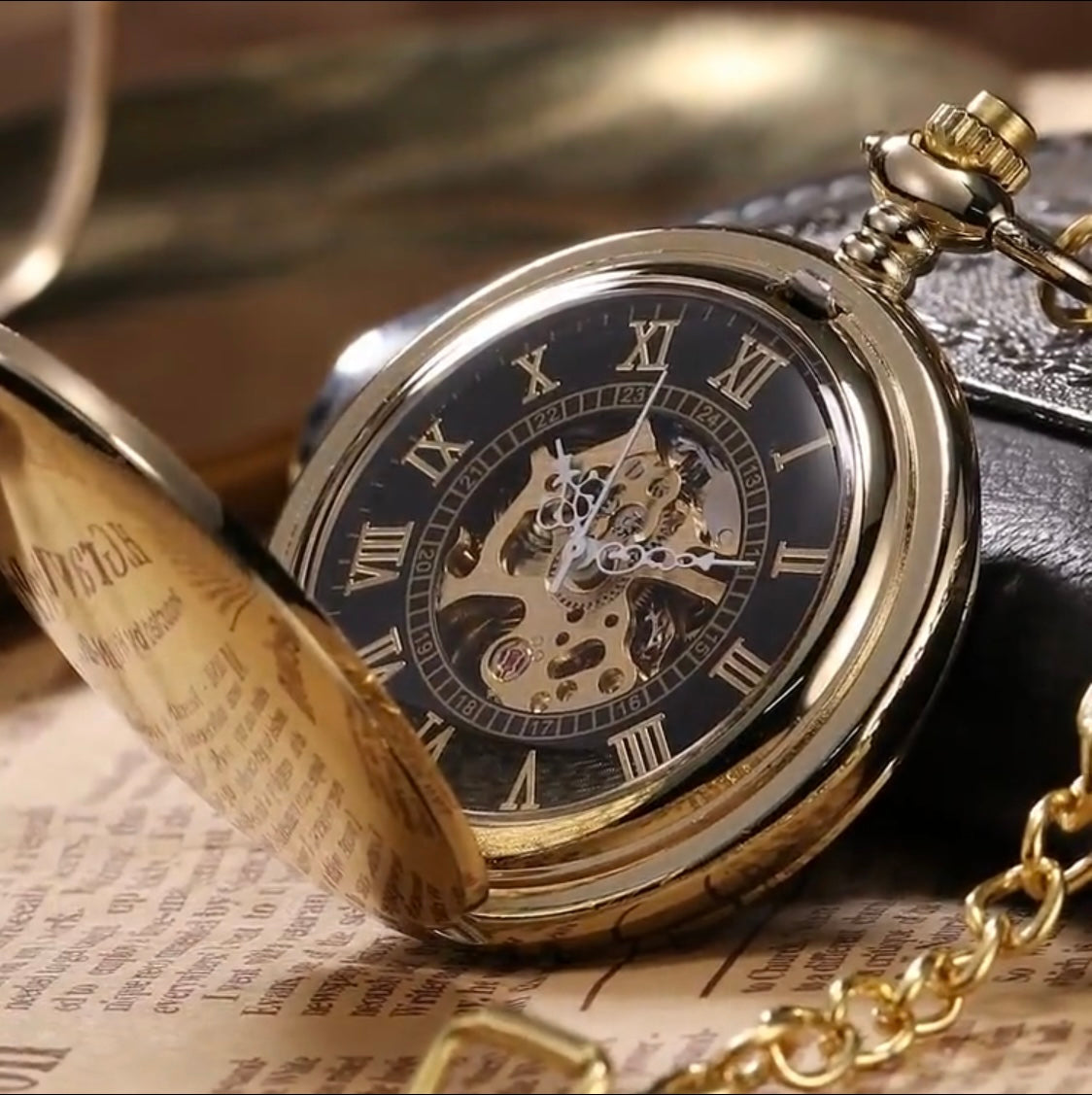 Gold pocket watch with black face and Roman numerals on an old newspaper background