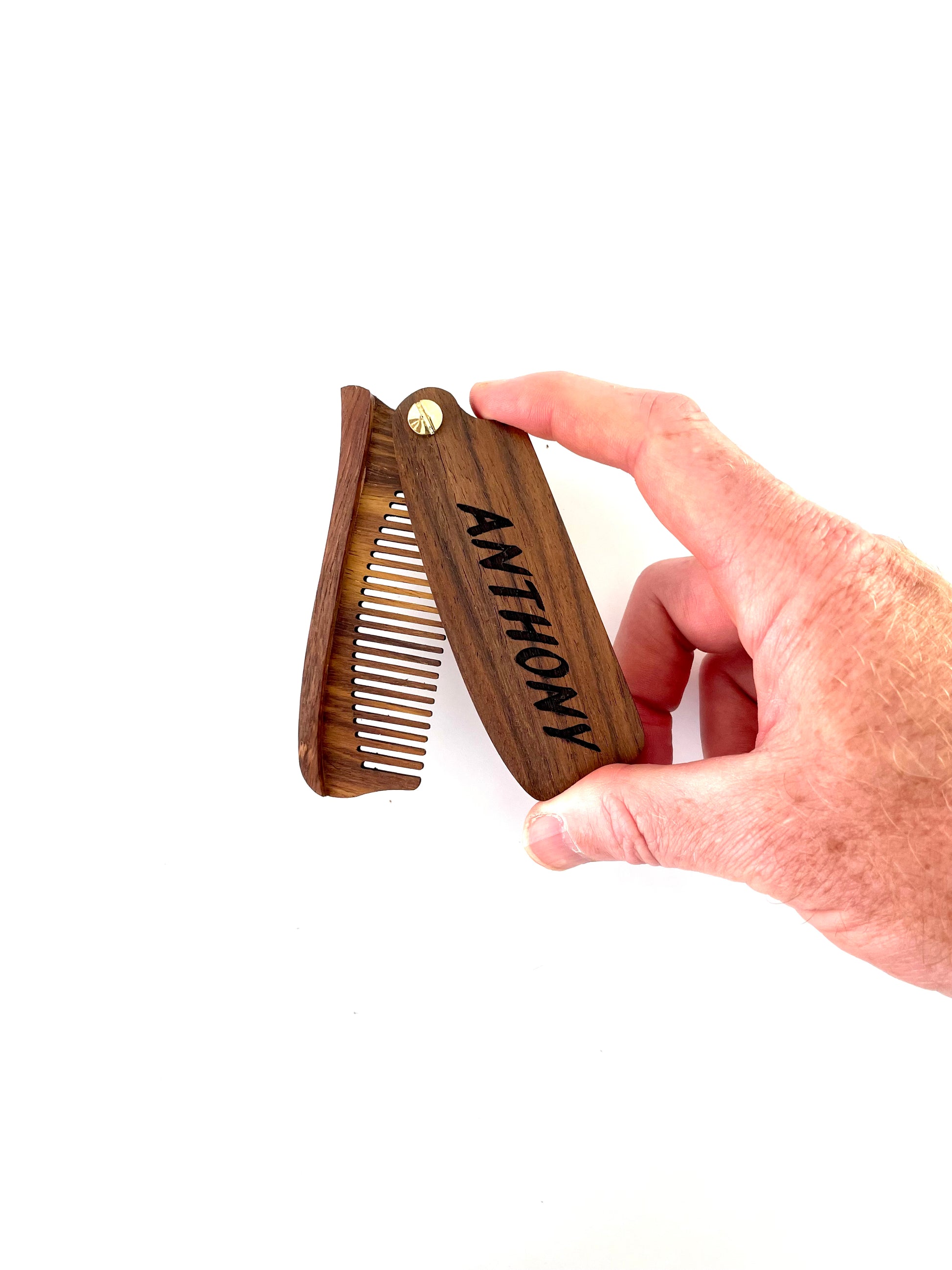 Made from eco friendly lightweight wood, your engraved wood beard comb makes for a unique gift for him.  Your personalized wood beard comb can be single or double sided engraved with letters, numbers or symbols.